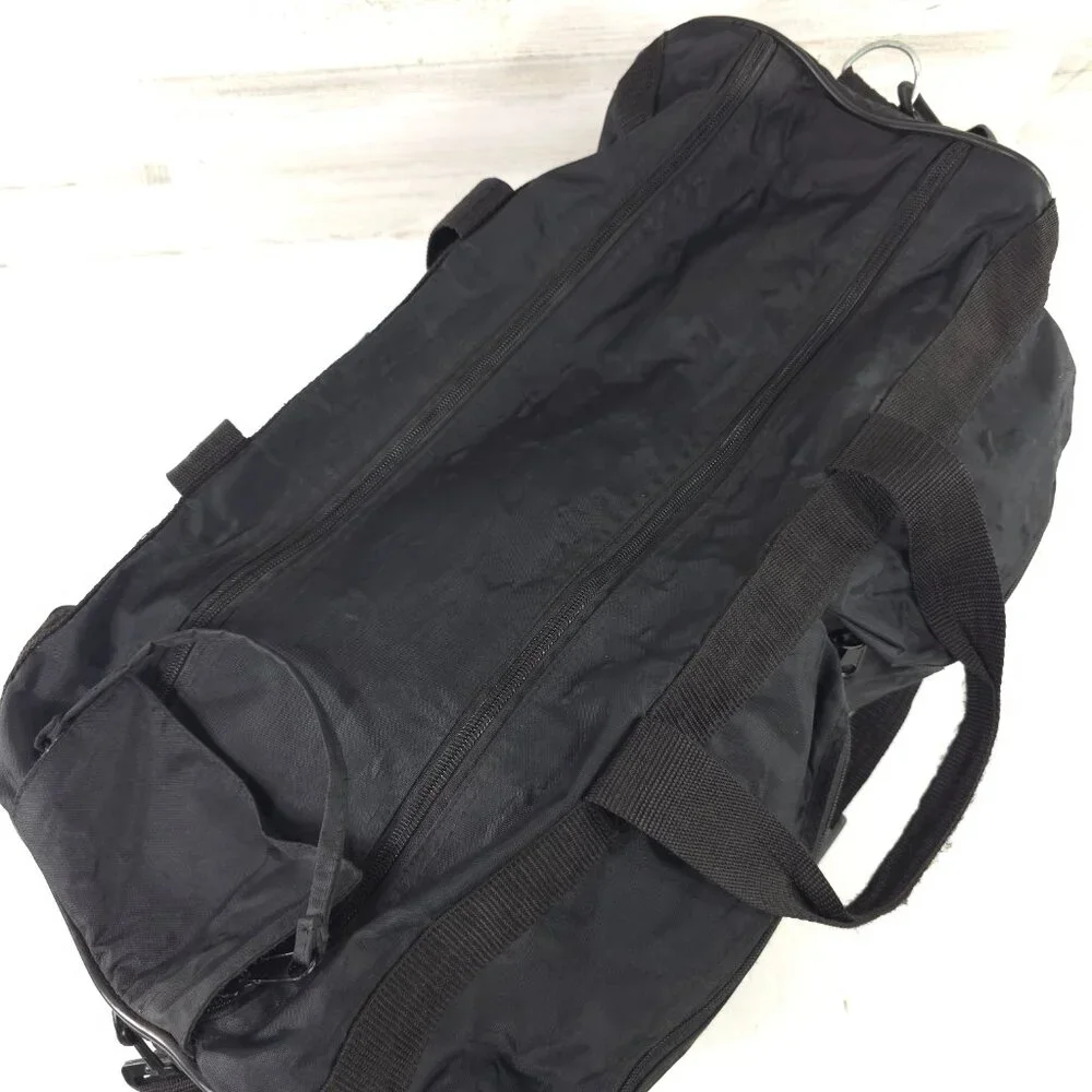 VINTAGE HARLEY DAVIDSON AN AMERICAN LEGEND BLACK DUFFLE BAG WITH SHOULDER STRAP.